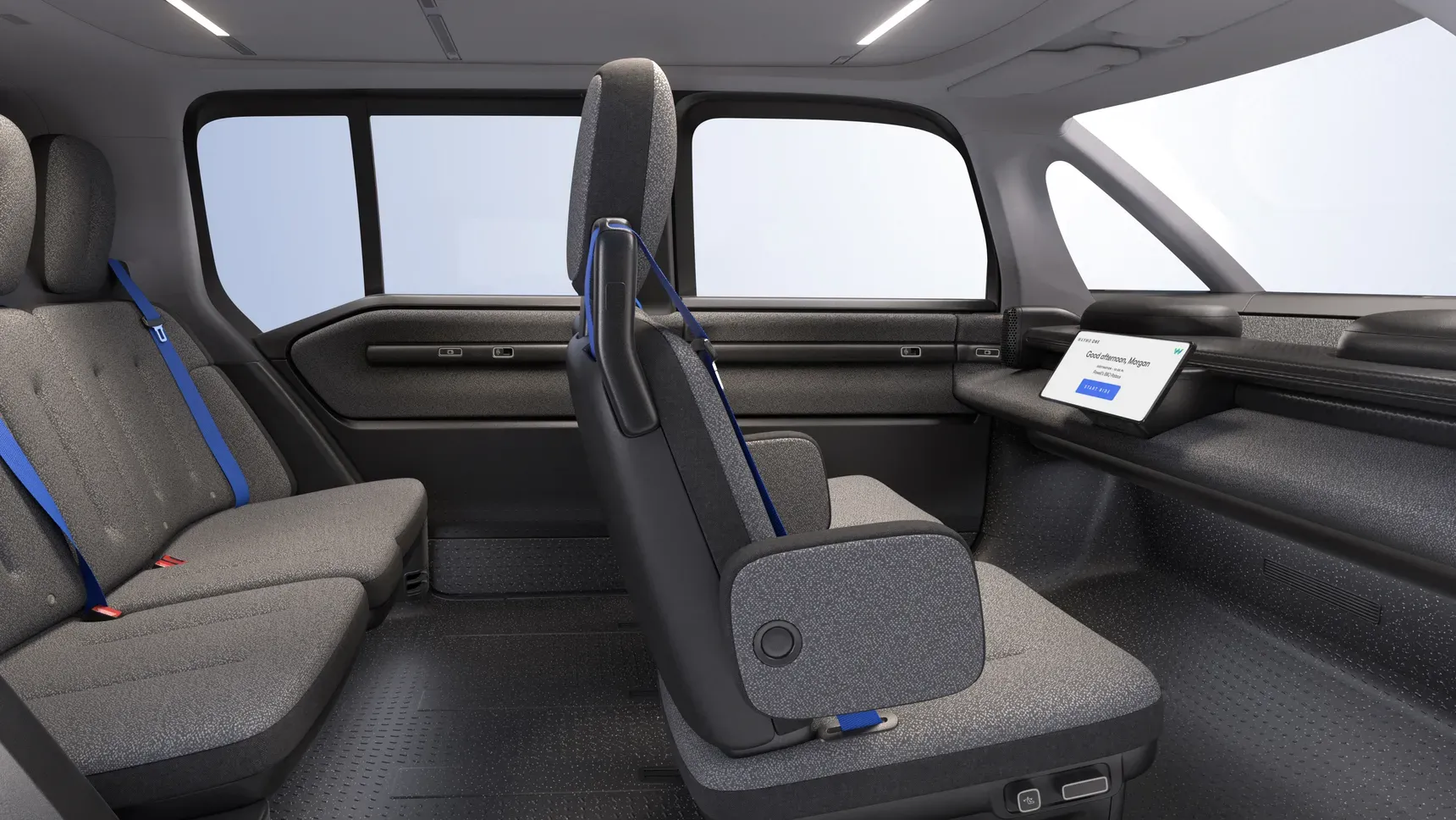 車のインテリアには、ハンドルやペダルはなく、スクリーンだけが設置される。Image via Waymo