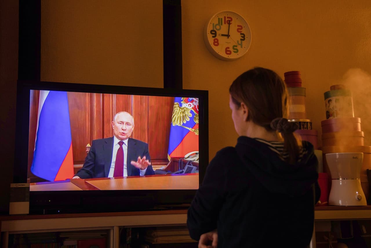 Vladimir Putin delivers an address on Feb. 22.